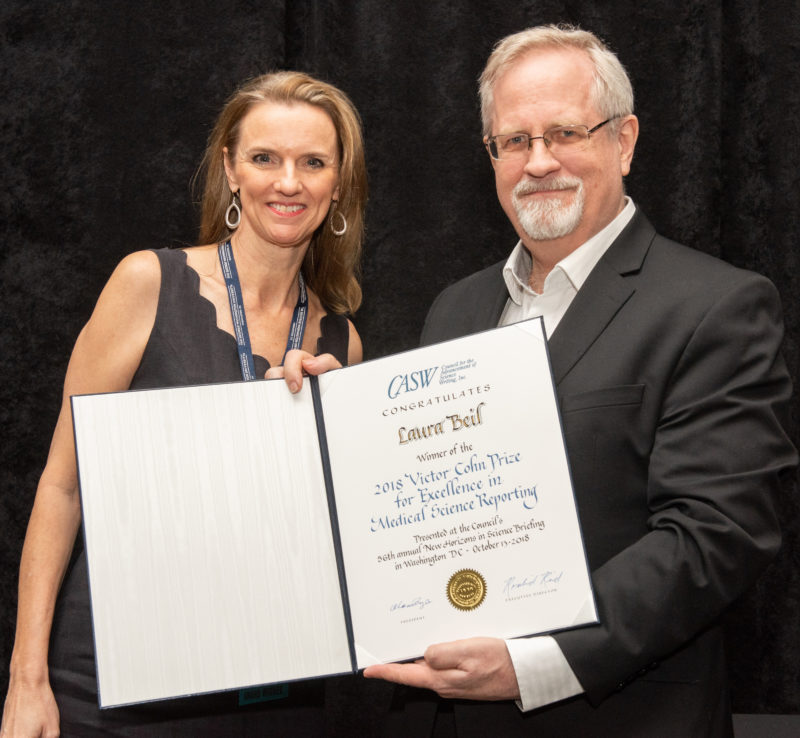 Laura Beil (left) with CASW President Alan Boyle (right) with the Cohn certificate