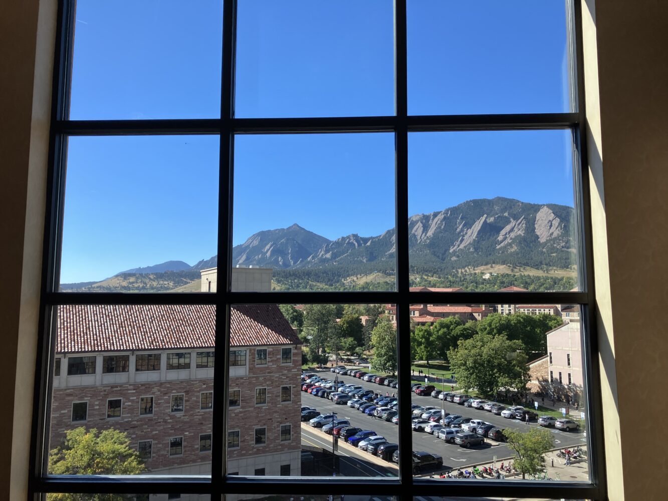 An image of downtown Boulder, Colorado taken from behind a window.