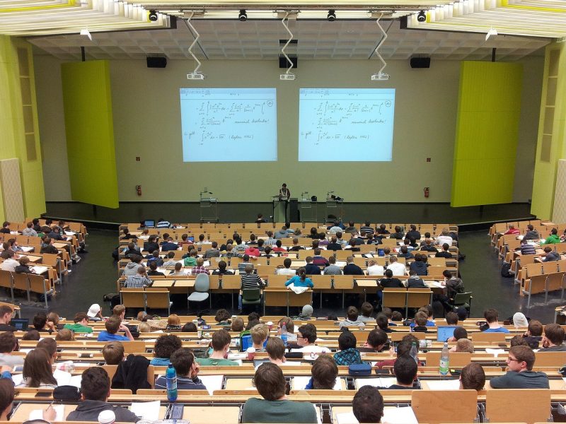 Students in a university theatre-style class